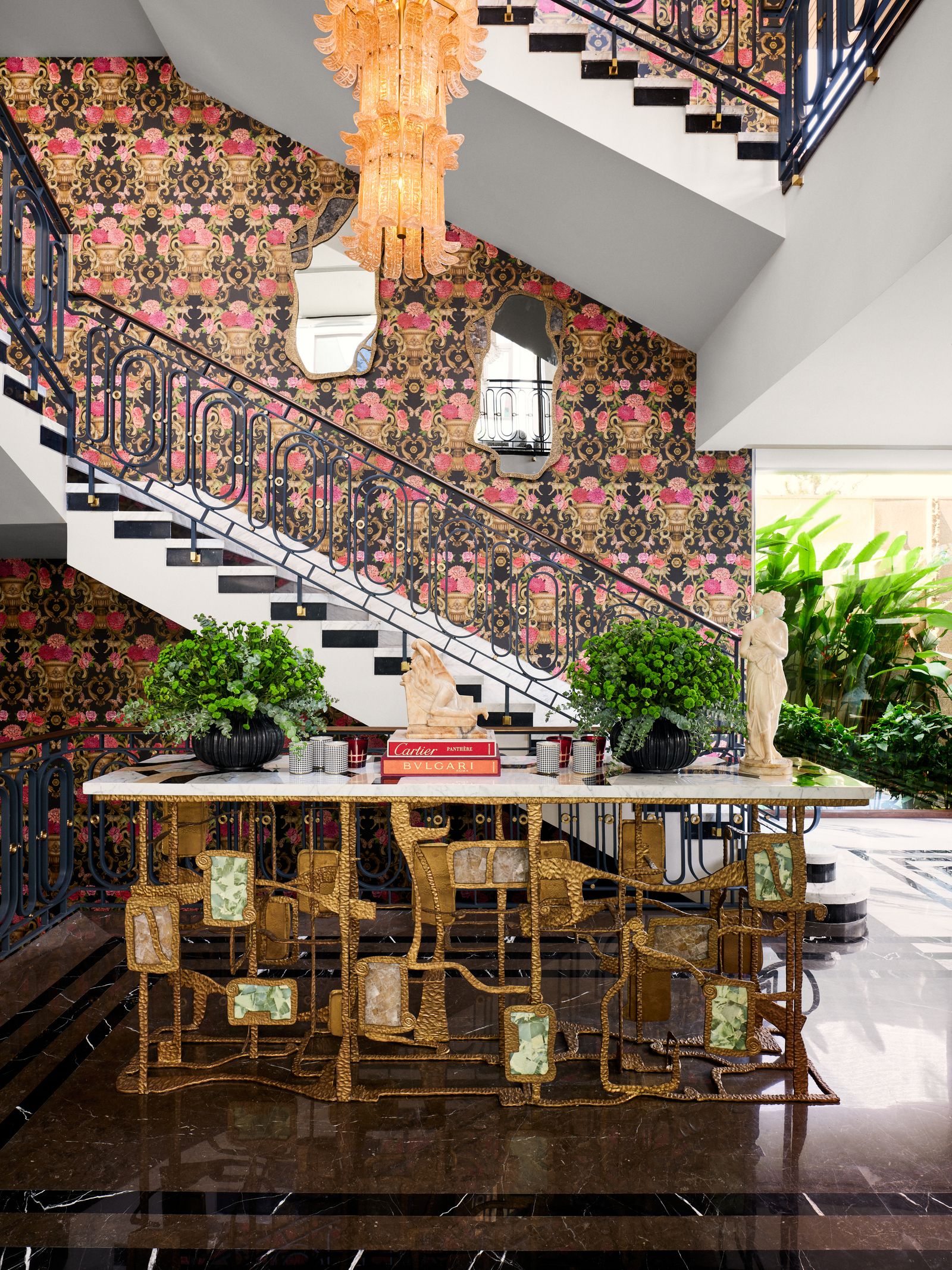 Image may contain Indoors Architecture Building Foyer Interior Design Dining Room Dining Table Furniture and Room
