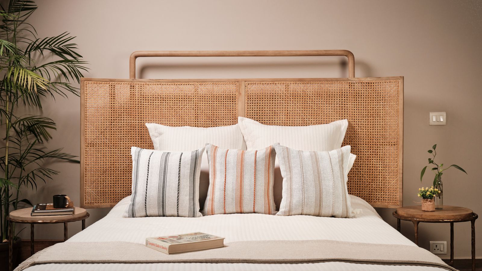 Image may contain Cushion Home Decor Book Publication Pillow Indoors Interior Design Bed Furniture Plant and Cup