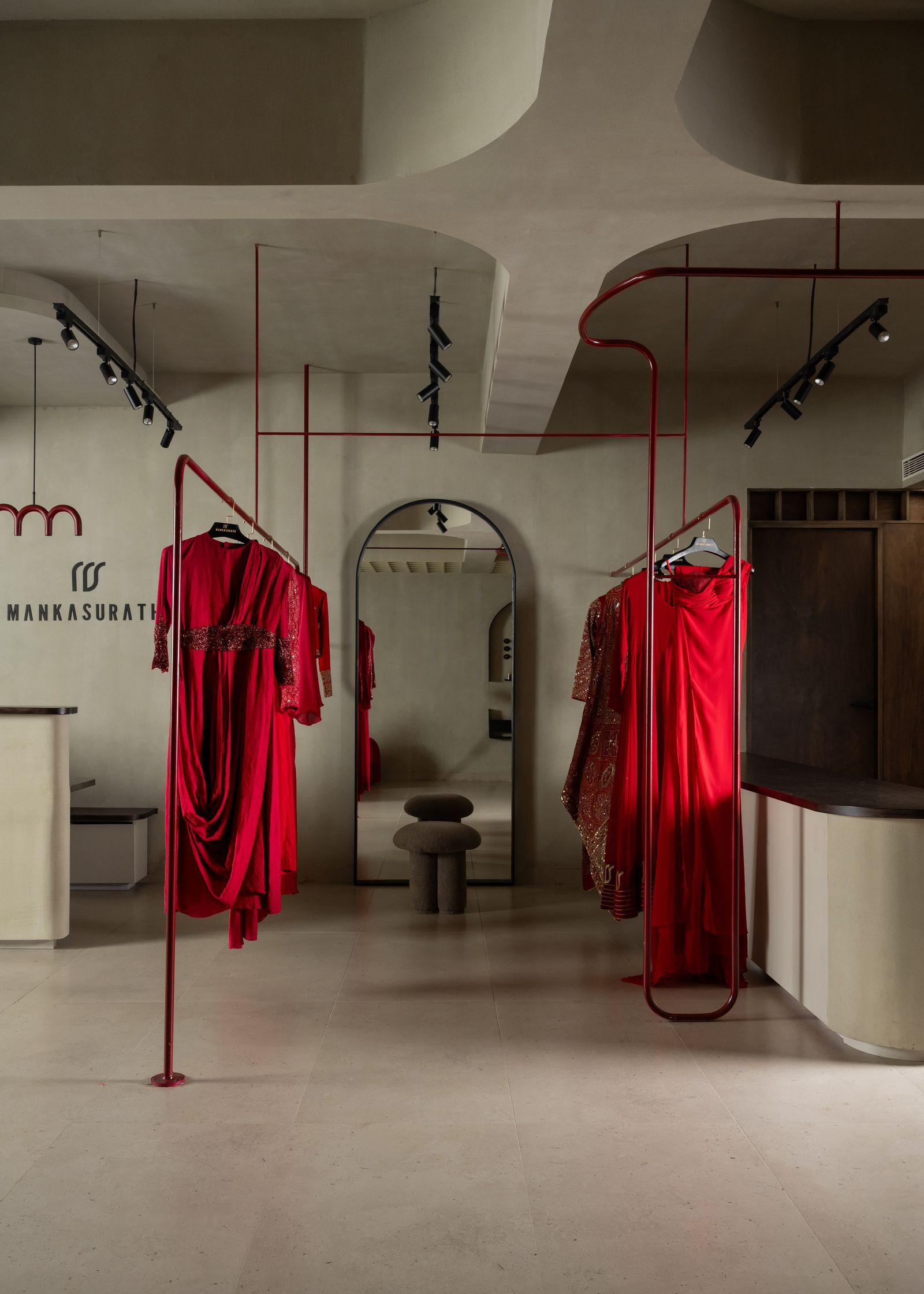 Image may contain Dressing Room Indoors Room Floor Flooring Boutique Shop Furniture and Interior Design