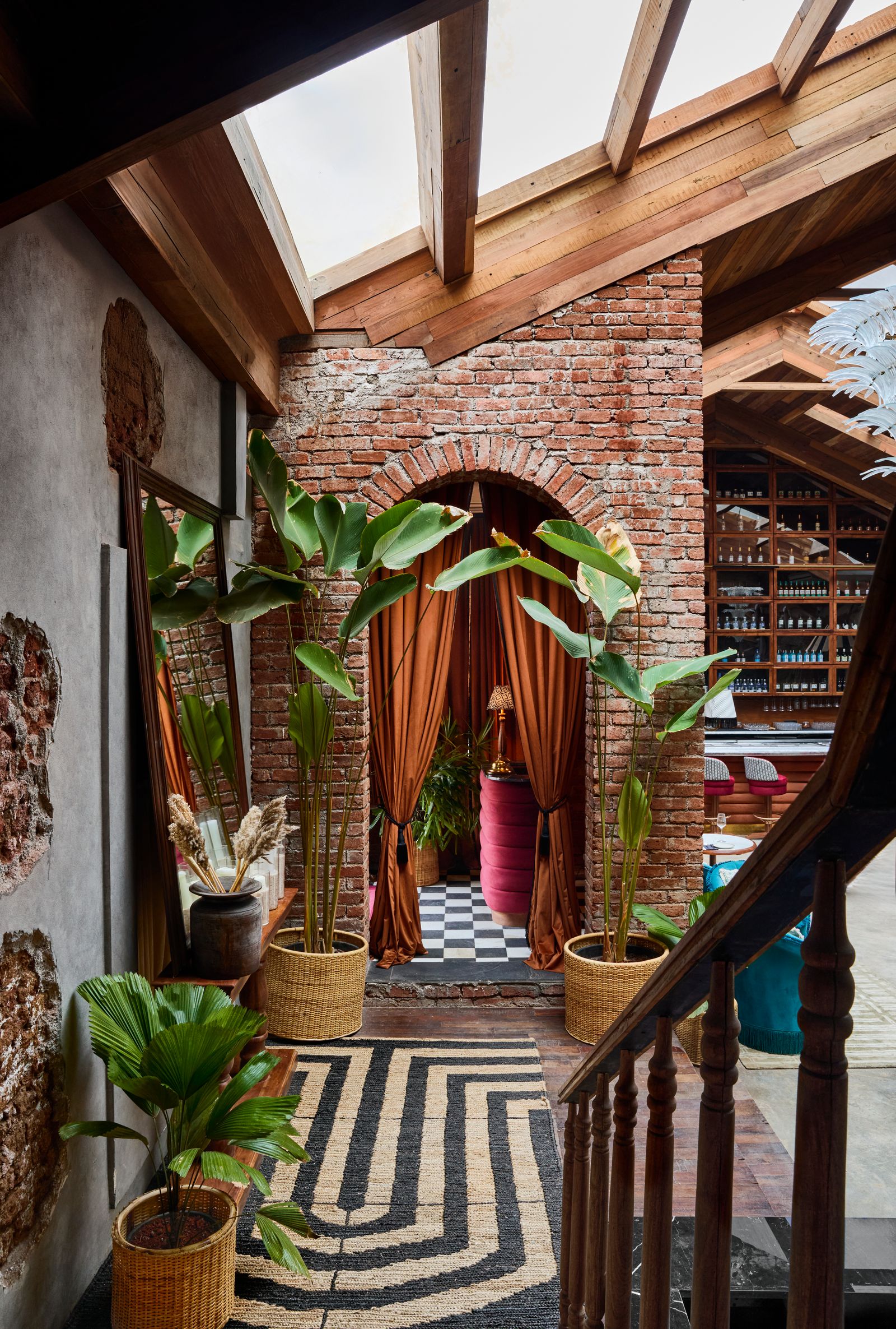 Image may contain Indoors Interior Design Floor Plant Chair Furniture Lamp Home Decor Bread Food and Architecture