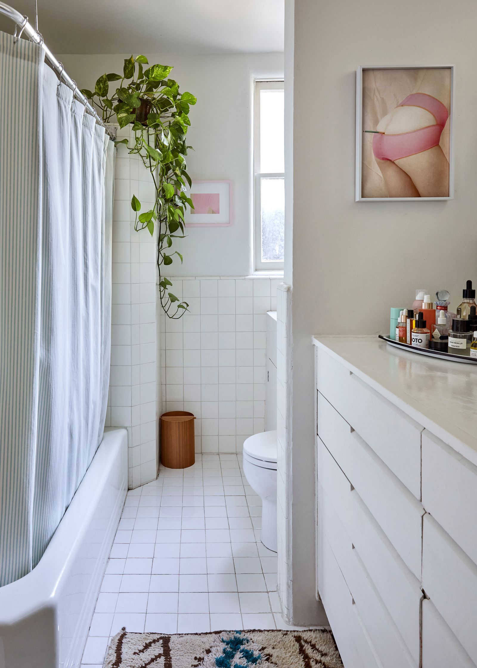 Image may contain Plant Home Decor Rug Bathing Bathtub Person Tub Art Painting Bathroom Indoors Room and Toilet