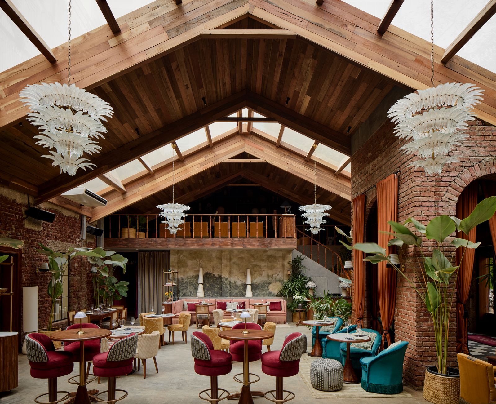Image may contain Lamp Architecture Building Dining Room Dining Table Furniture Indoors Room Table Plant and Chair