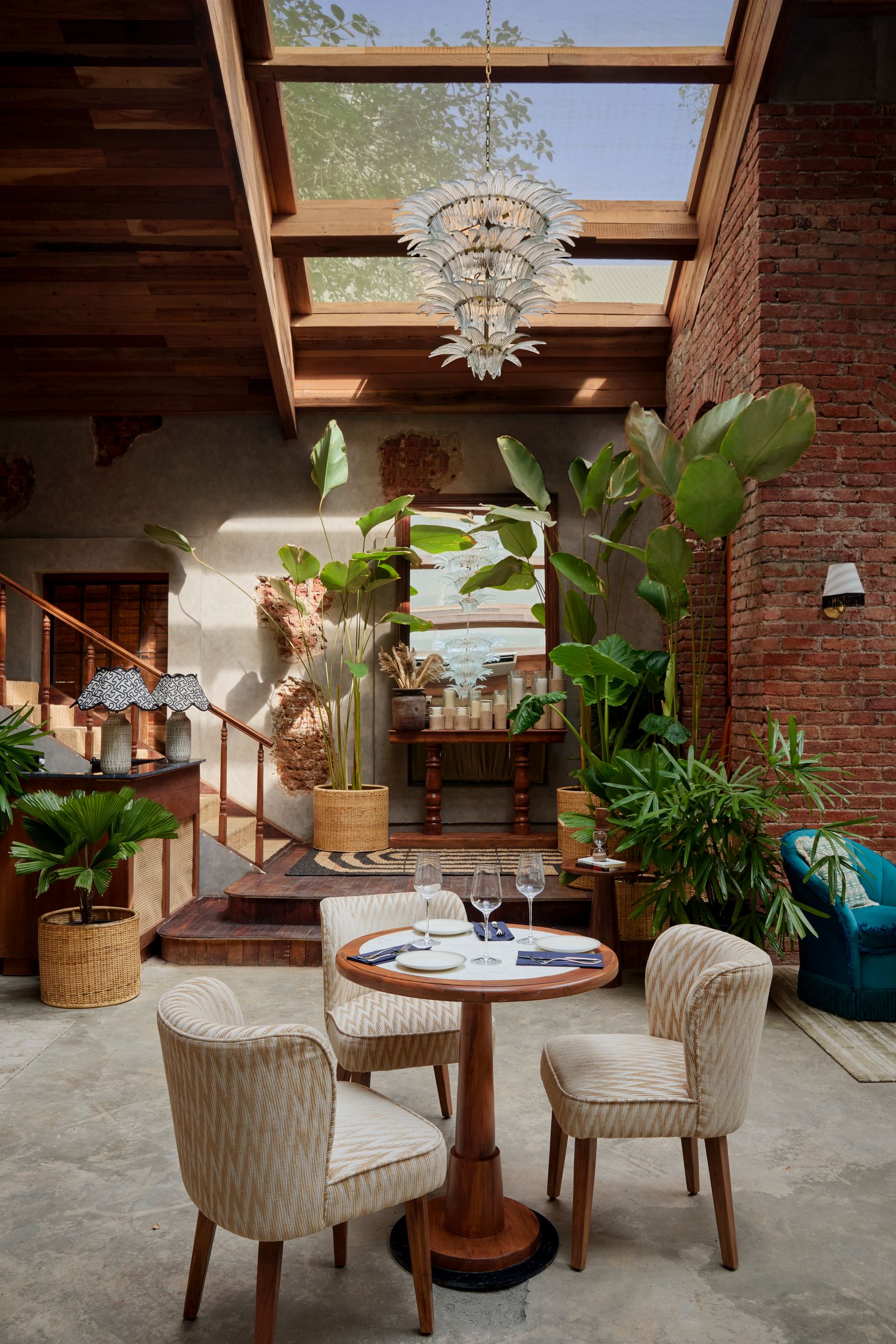 Image may contain Architecture Building Dining Room Dining Table Furniture Indoors Room Table Chair and Lamp