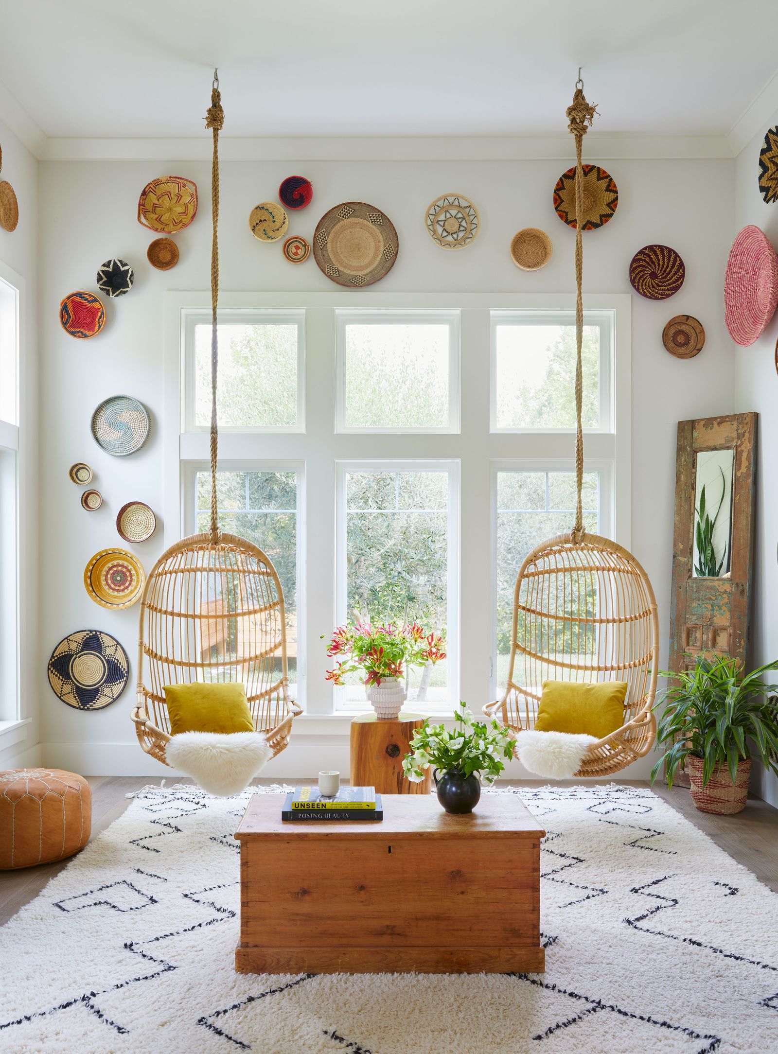 Image may contain Home Decor Plant Rug Cup Plate Window Chair Furniture Coffee Table Table and Architecture