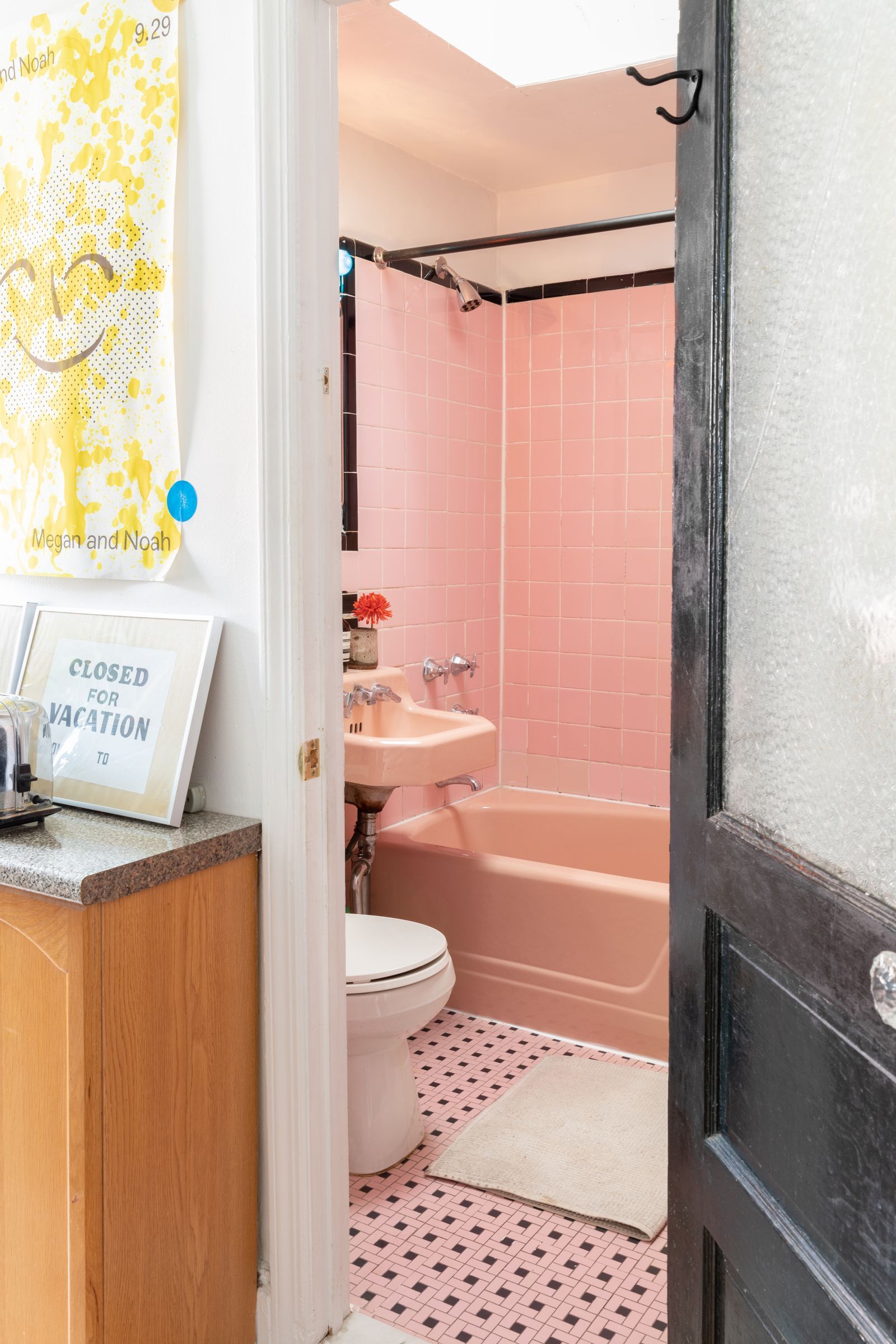 Image may contain Sink Home Decor Rug Indoors Bathing Bathtub Person Tub Bathroom Room Toilet and Sink Faucet