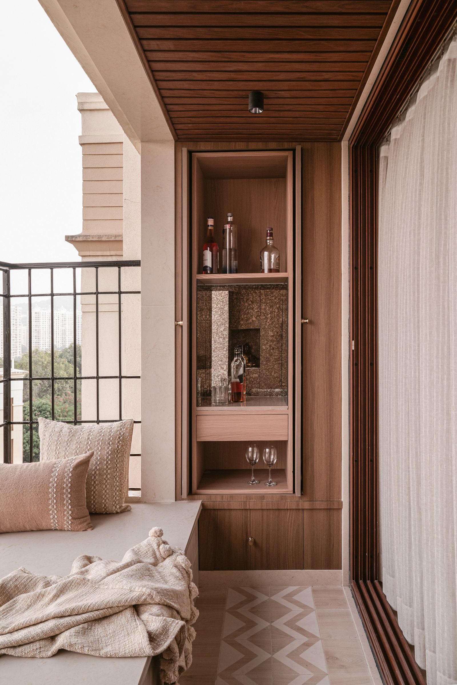 Image may contain Indoors Interior Design Architecture Balcony Building Lamp Person and Wood Panels