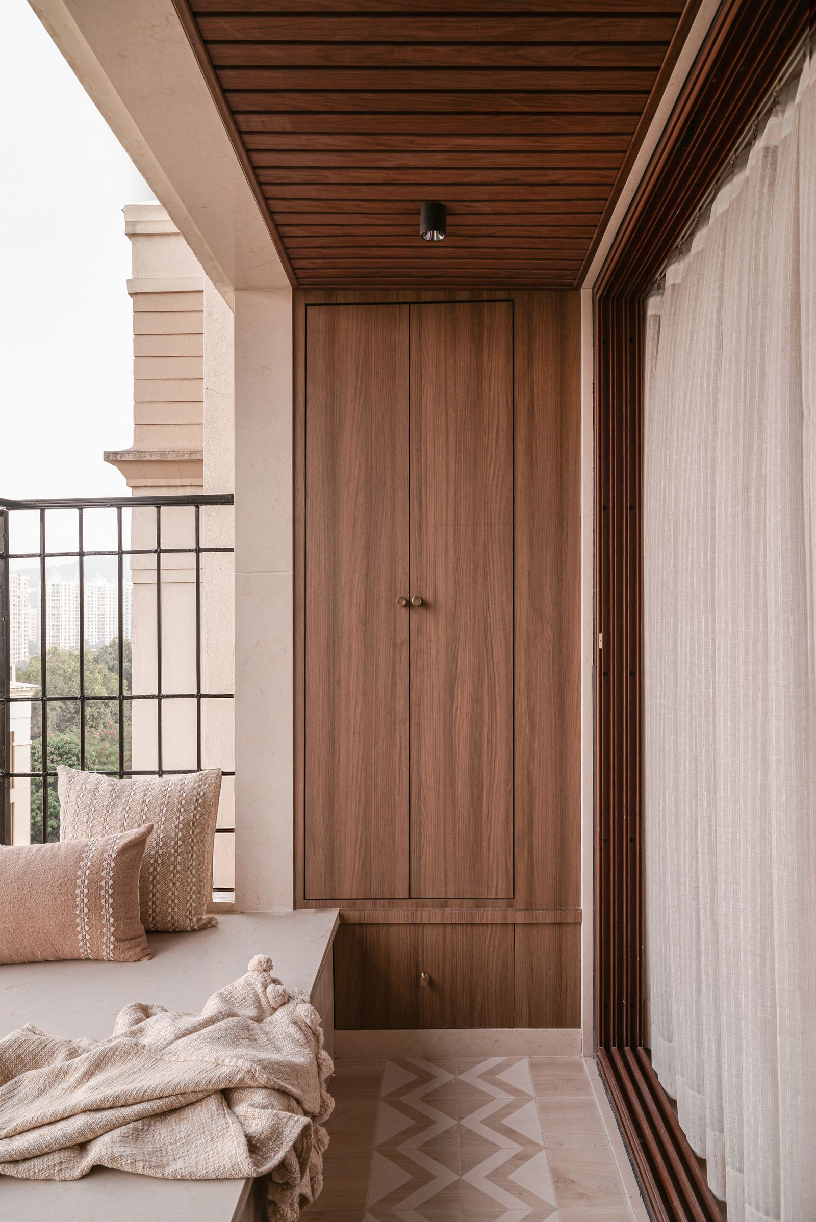 Image may contain Indoors Interior Design Wood Panels and Lamp