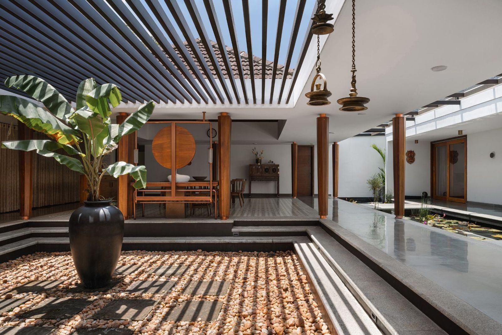 Image may contain Plant Lamp Indoors Interior Design Floor Chair Furniture Architecture Building and Foyer