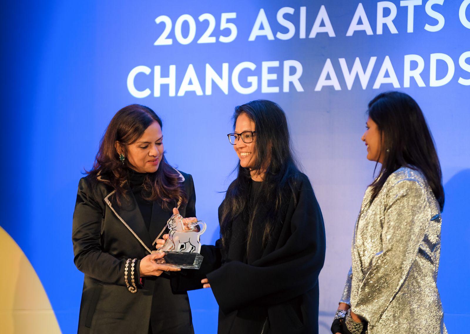 Image may contain Shilpa Gupta Sushmita Mukherjee Adult Person Accessories Glasses People Conversation and Clothing