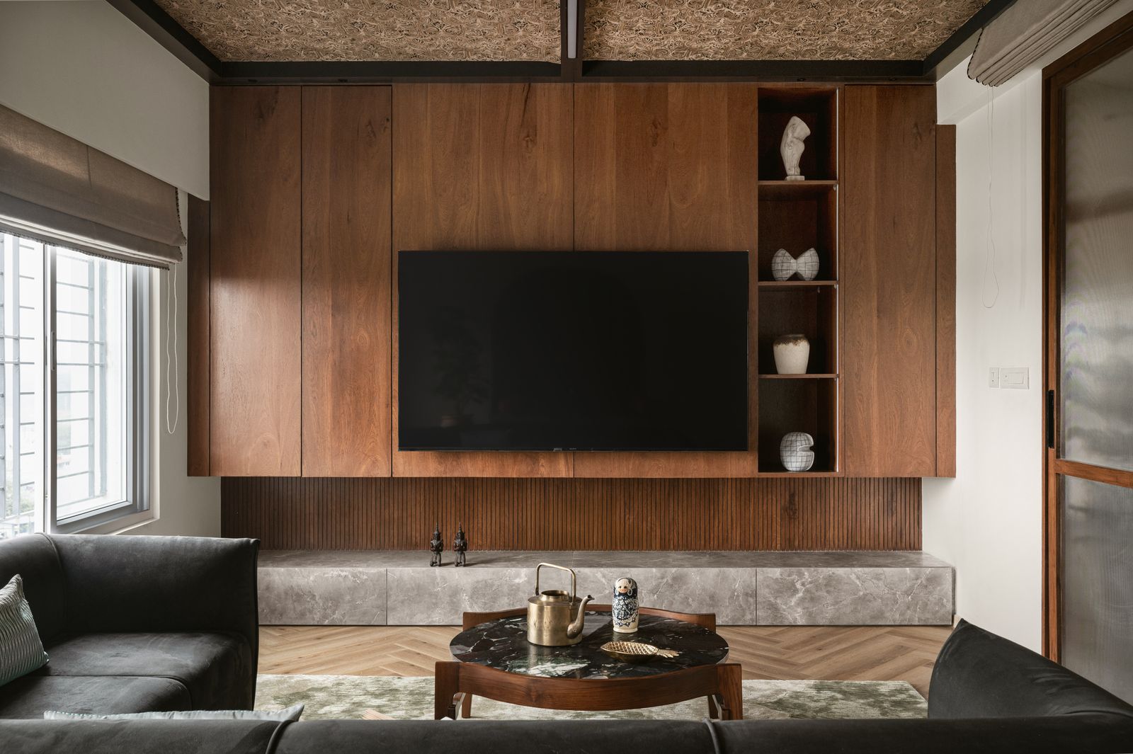 Image may contain Indoors Interior Design Wood Panels Person Architecture Building Furniture Living Room and Room
