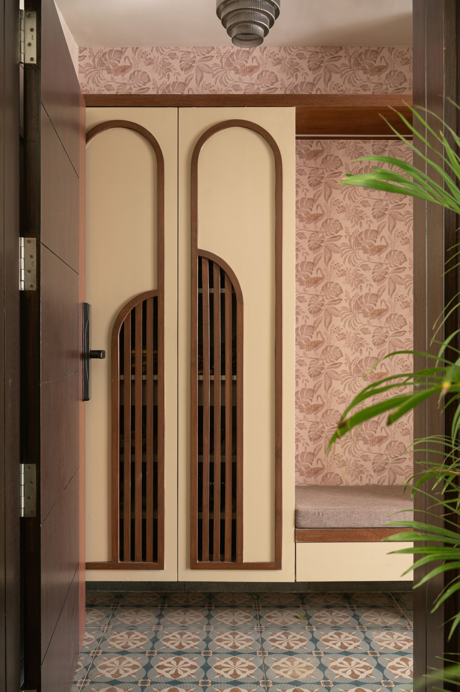 Image may contain Indoors Interior Design Door Floor Plant Arch and Architecture