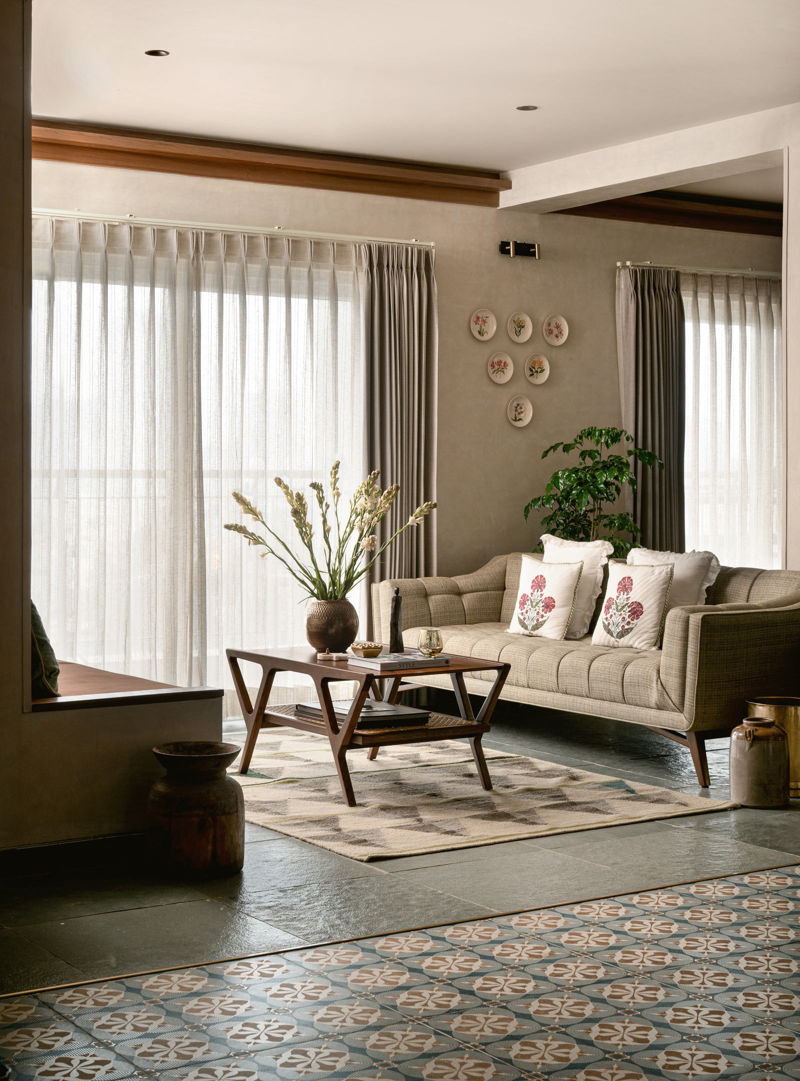 Image may contain Home Decor Coffee Table Furniture Table Architecture Building Indoors Living Room Room and Rug