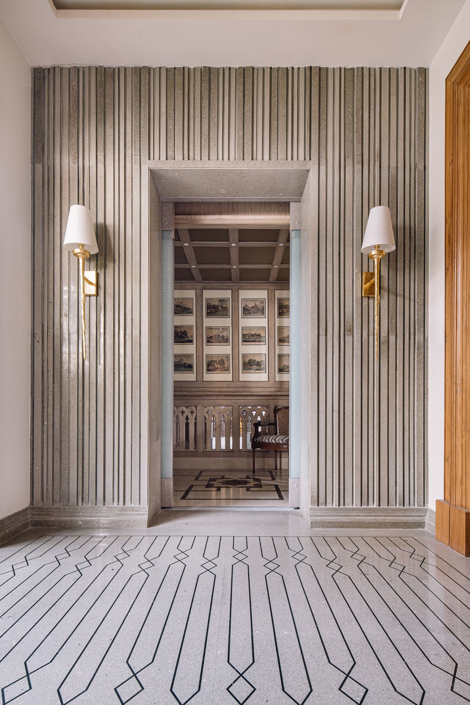 Image may contain Indoors Interior Design Wood Panels Floor Chair Furniture and Lamp