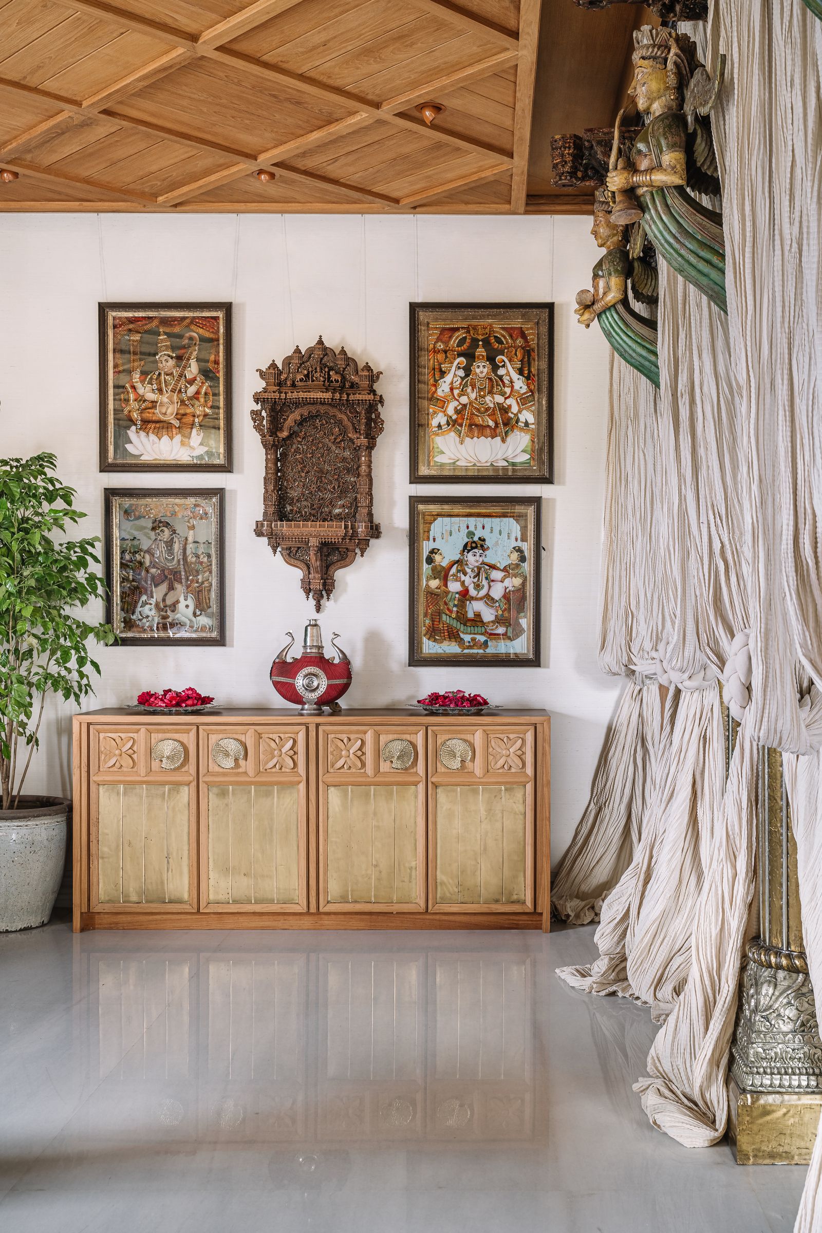 Image may contain Indoors Interior Design Furniture Sideboard Plant Art Painting Wood Home Decor Floor and Person