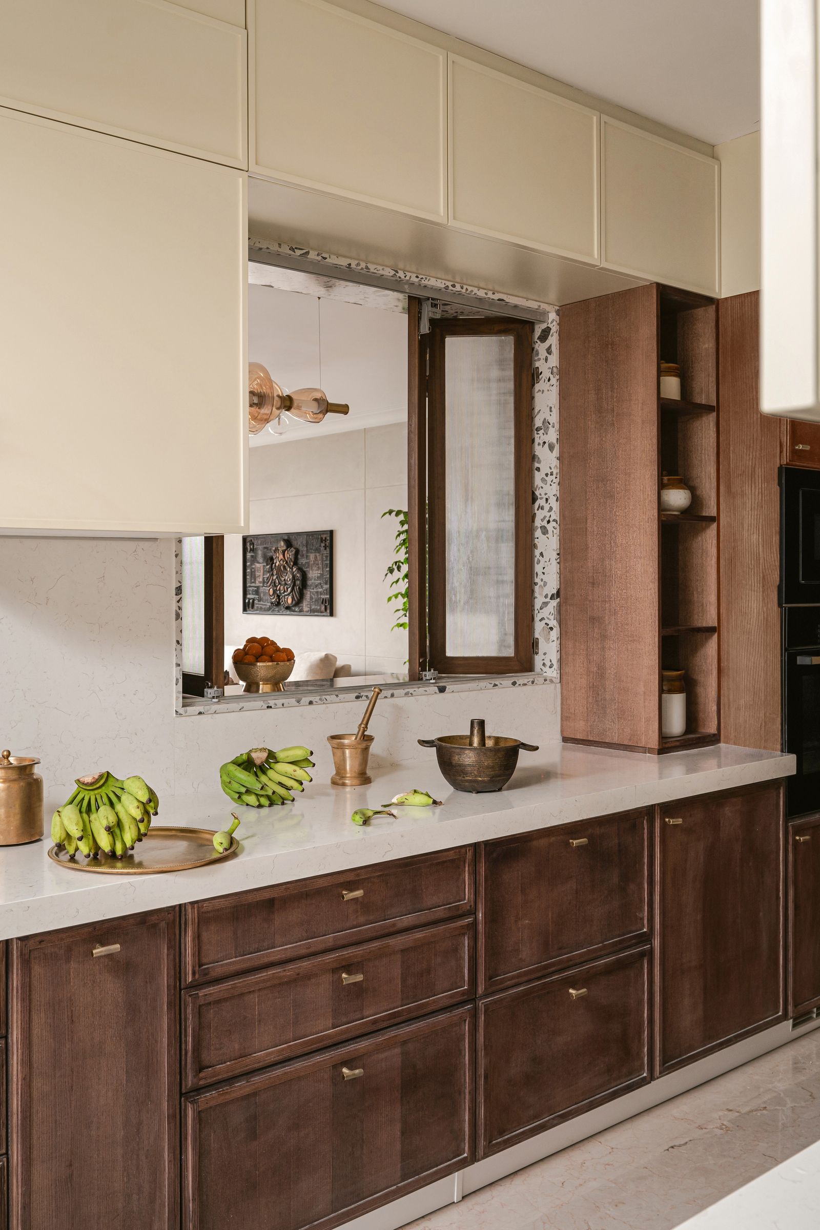 Image may contain Indoors Interior Design Banana Food Fruit Plant Produce Cabinet Furniture Kitchen and Art