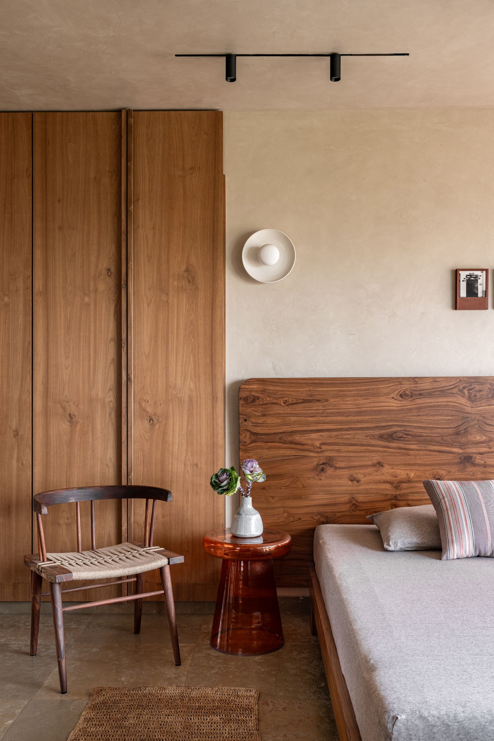 Image may contain Indoors Interior Design Chair Furniture Wood Hardwood Home Decor Rug Wood Panels and Stained Wood
