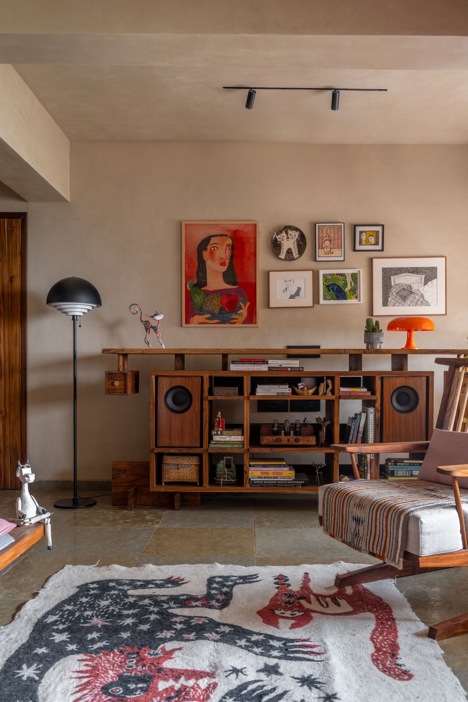 Image may contain Home Decor Rug Architecture Building Furniture Indoors Living Room Room Plant and Lamp