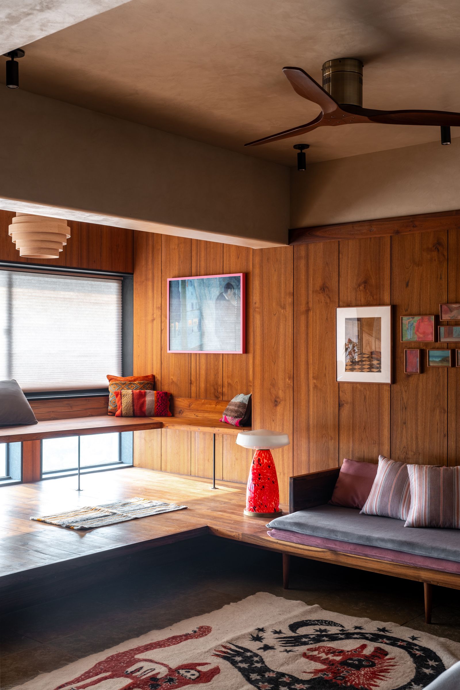 Image may contain Indoors Interior Design Appliance Ceiling Fan Device Electrical Device Home Decor Rug and Art
