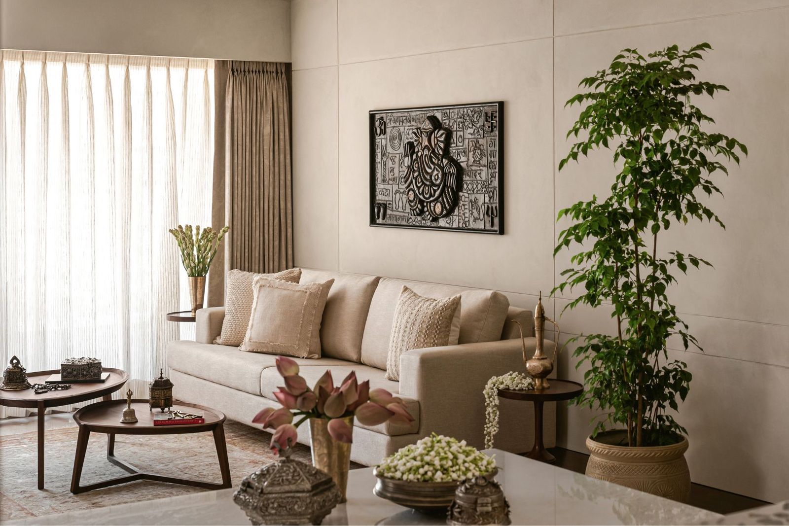Image may contain Home Decor Plant Furniture Table Architecture Building Indoors Living Room Room and Couch
