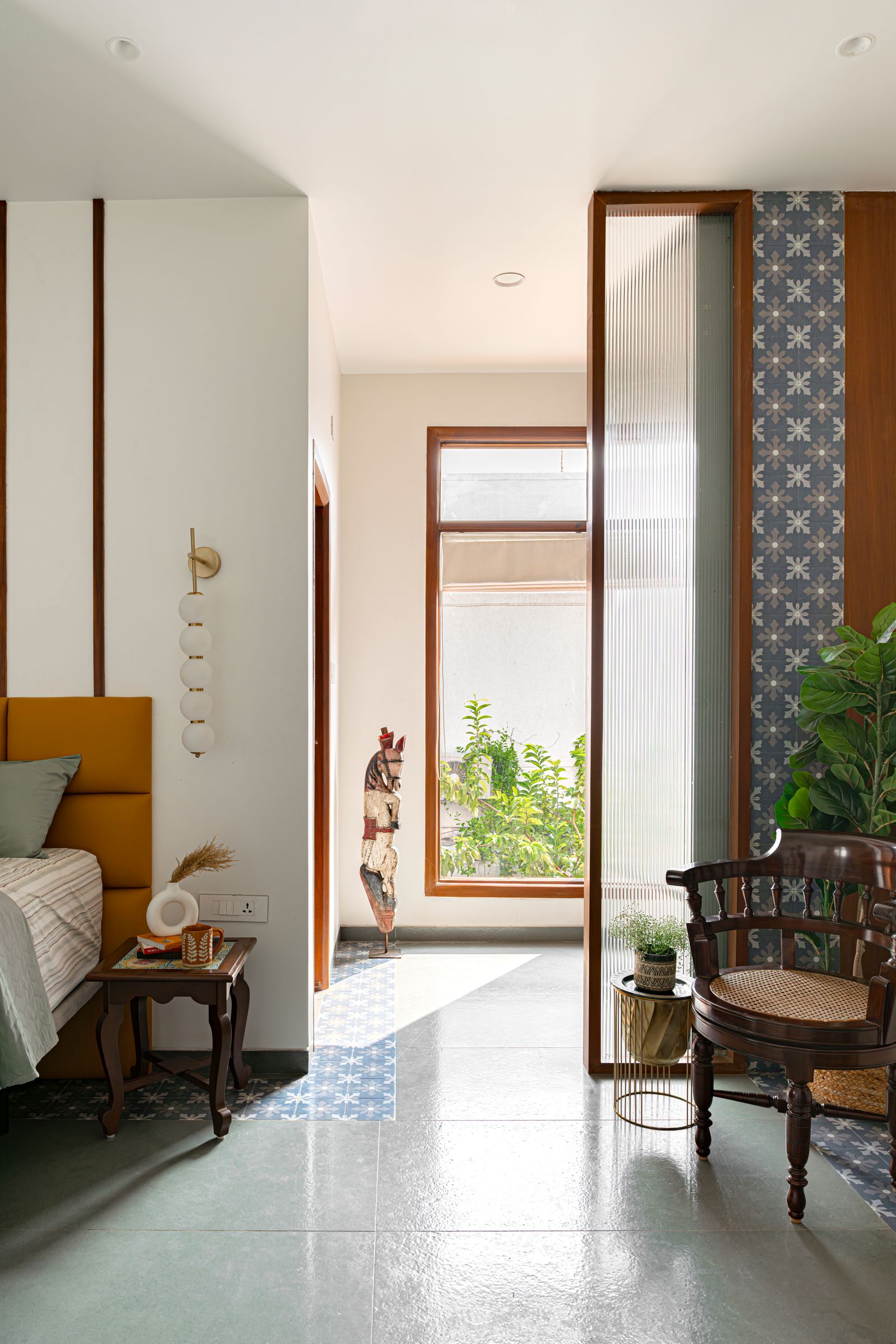Image may contain Floor Chair Furniture Flooring Indoors Interior Design Bed Plant Home Decor Door Desk and Table