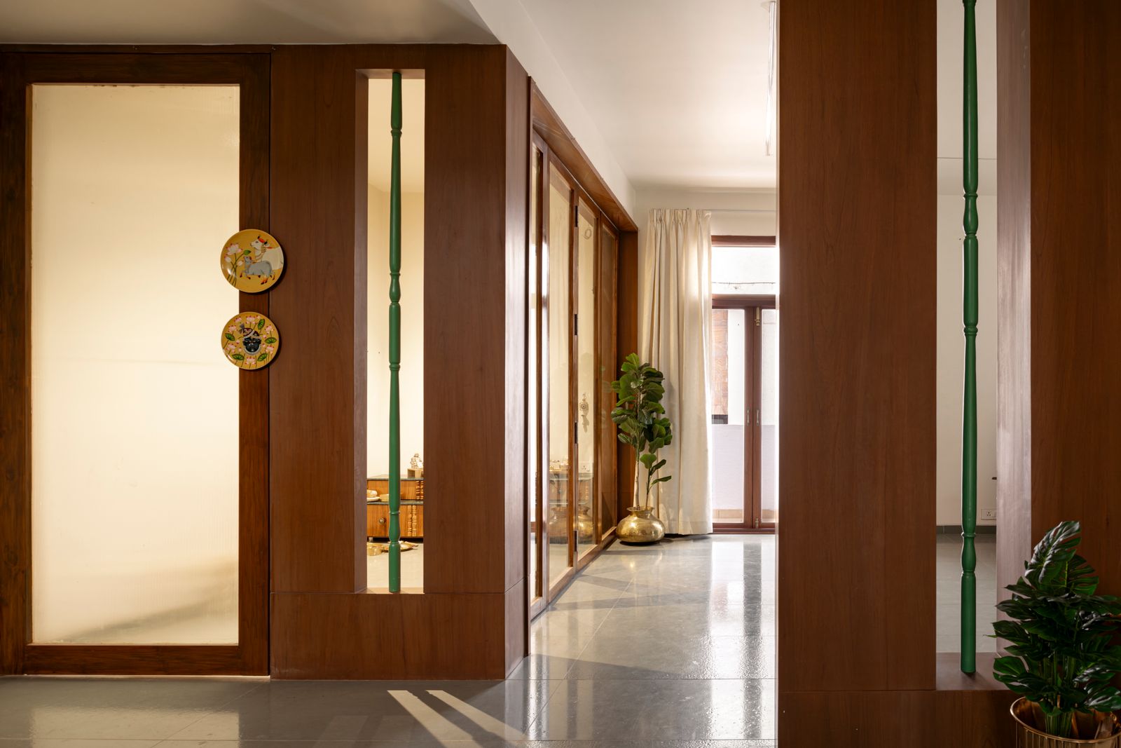 Image may contain Indoors Interior Design Plant Door Plate and Floor