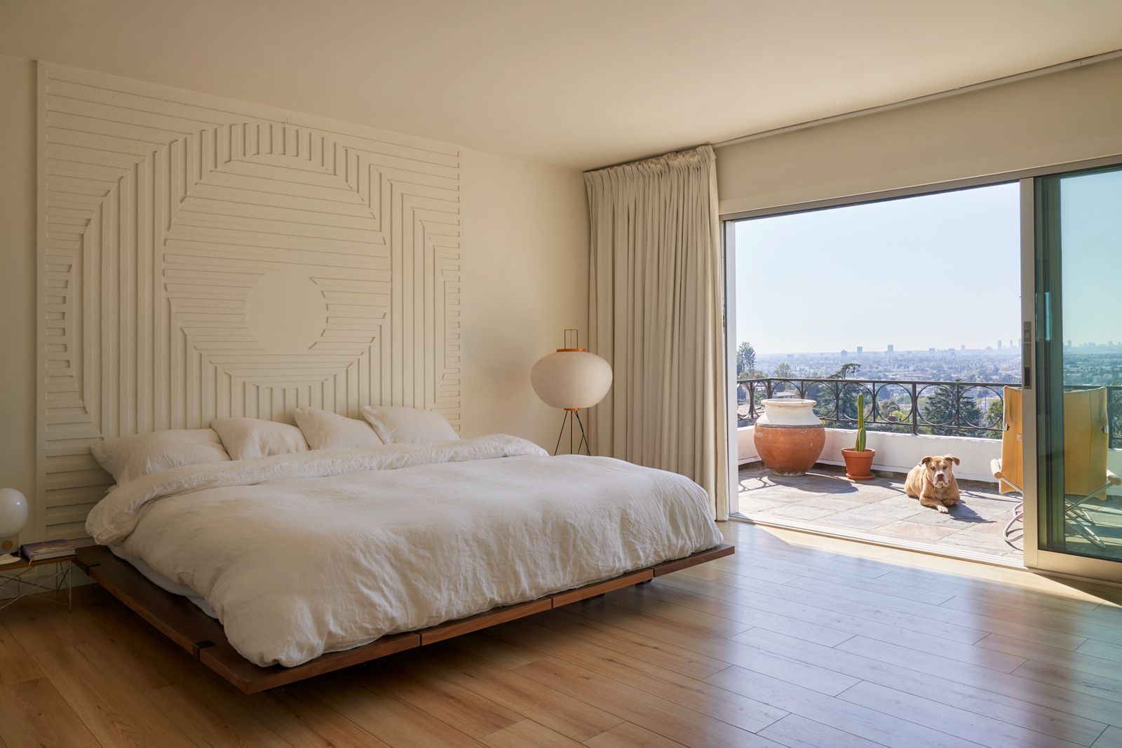 Image may contain Indoors Interior Design Plant Lamp Bed Furniture Animal Canine Dog Mammal Pet and Home Decor