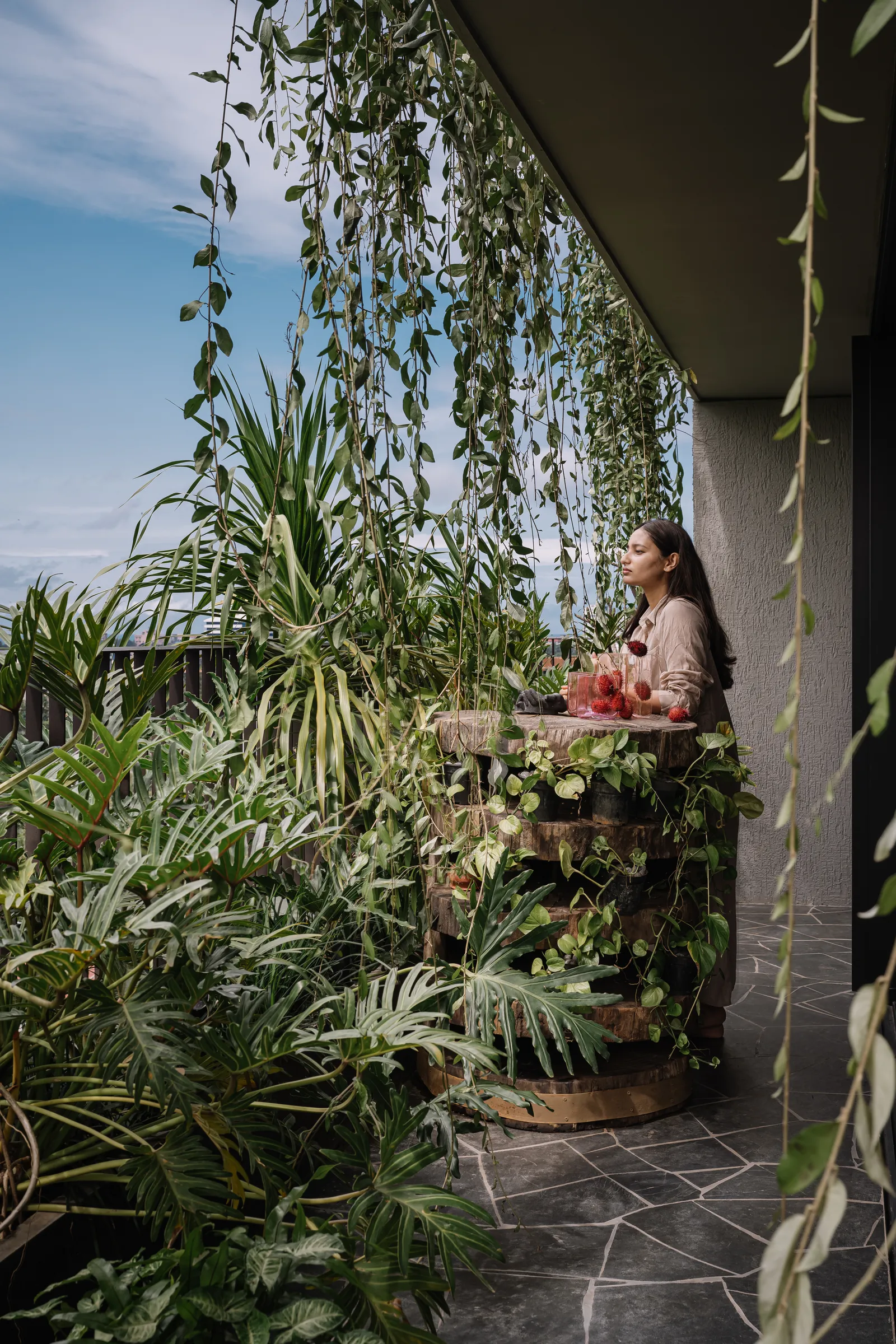Image may contain Garden Nature Outdoors Person Sitting Adult Architecture Balcony and Building