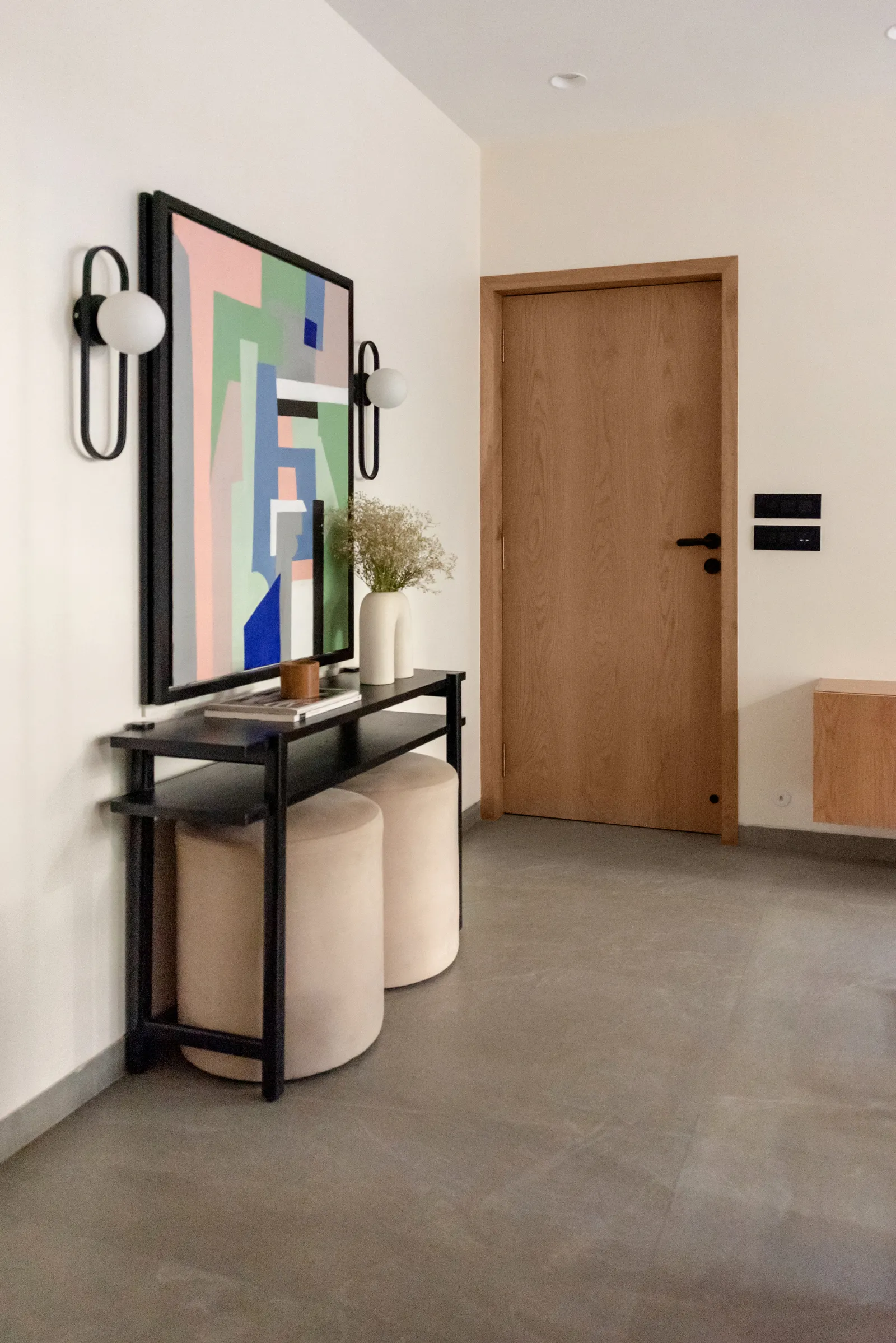 Image may contain Corner Indoors Interior Design Floor Flooring Architecture Building Foyer Furniture and Door
