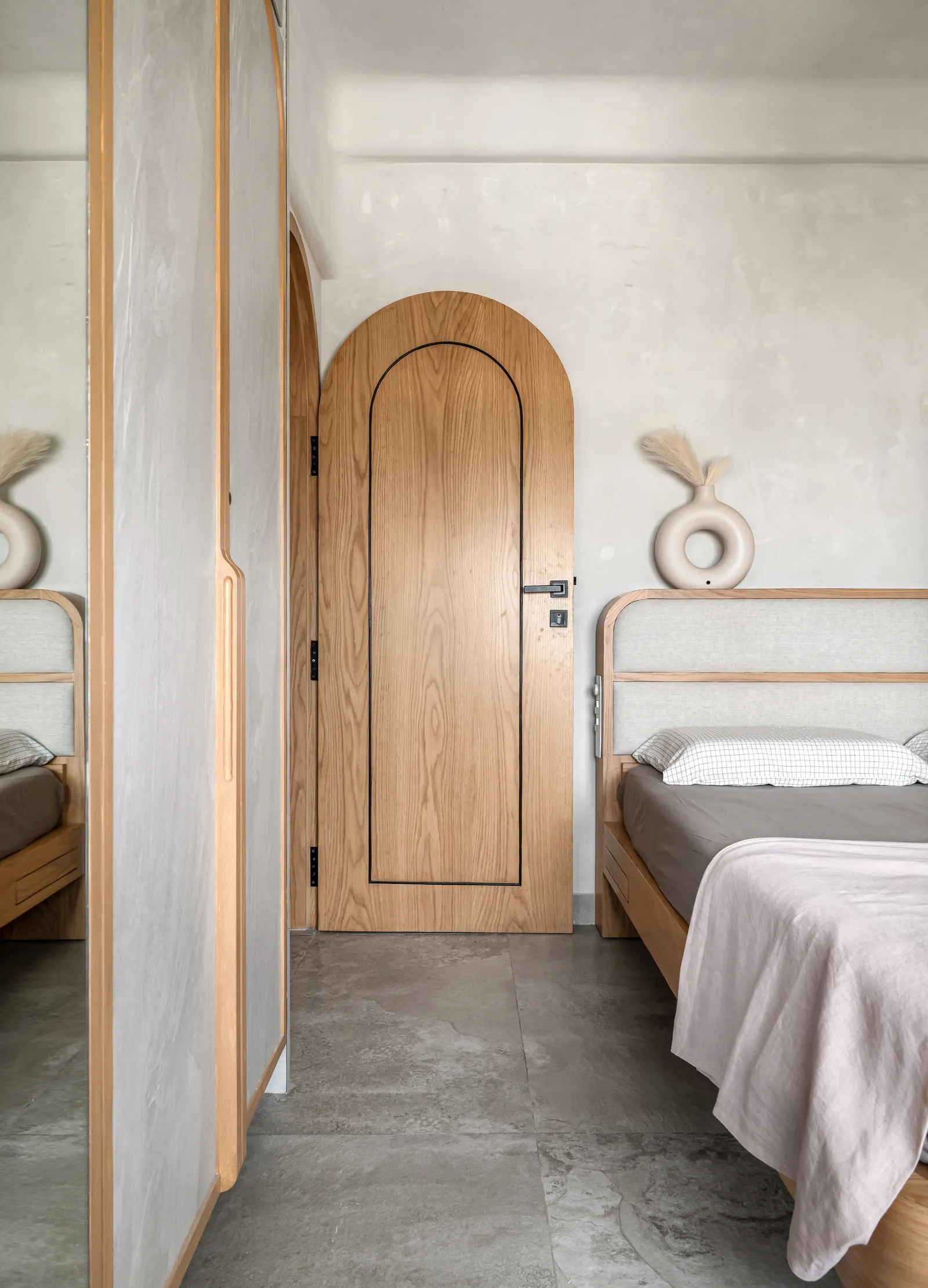 Image may contain Indoors Interior Design Wood Floor Hardwood Stained Wood Bed Furniture Bedroom and Room
