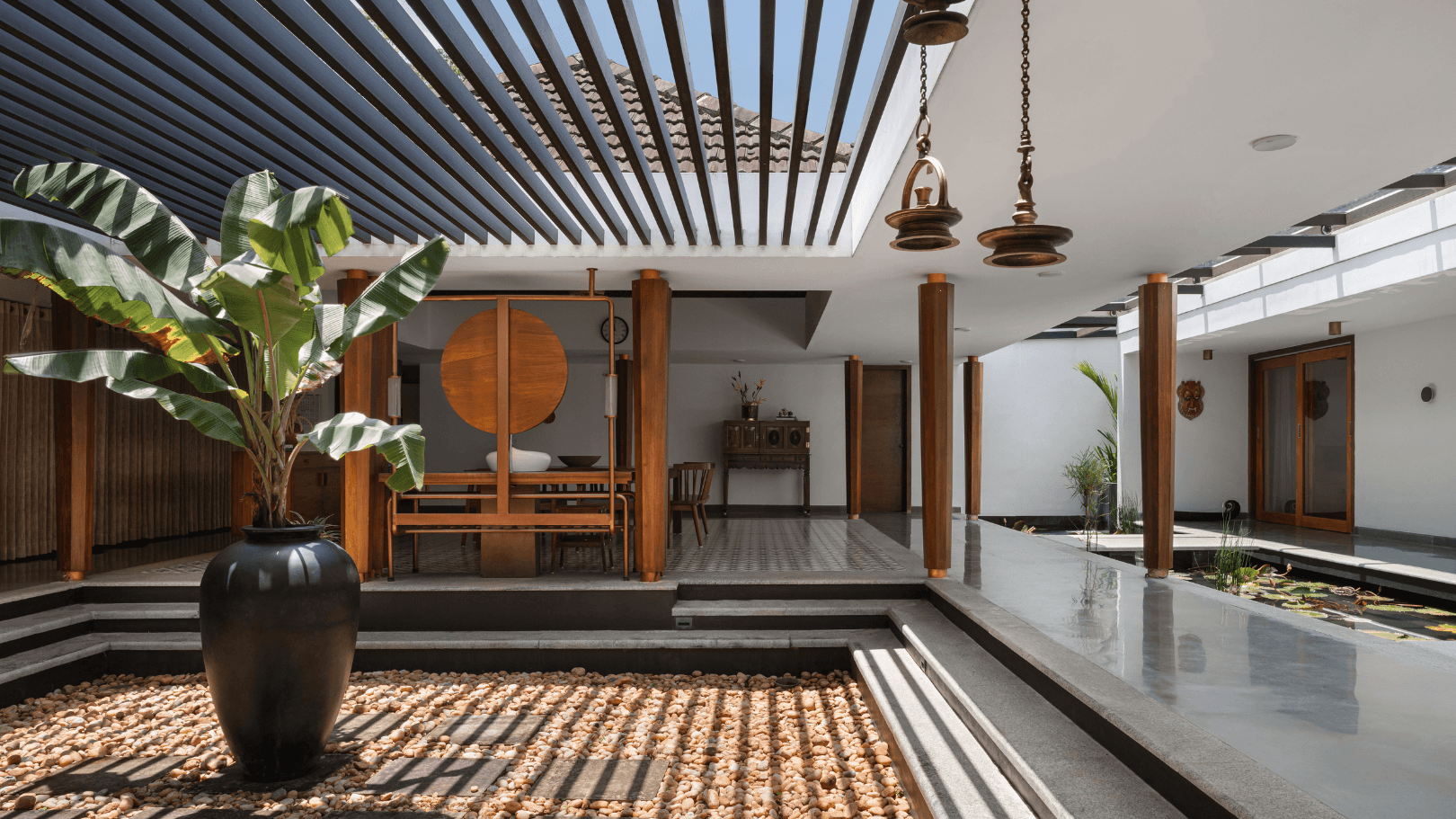 Image may contain Floor Indoors Interior Design Flooring Plant Architecture Building Foyer Home Decor and Chair
